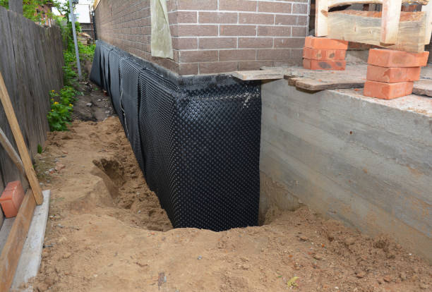 Happy homeowners after waterproofing job in Miller Place